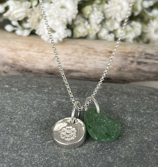 A handmade fine silver Devon eco primrose necklace