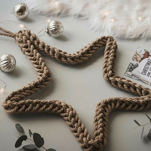 Braided wreath on a light surface with decorative elements