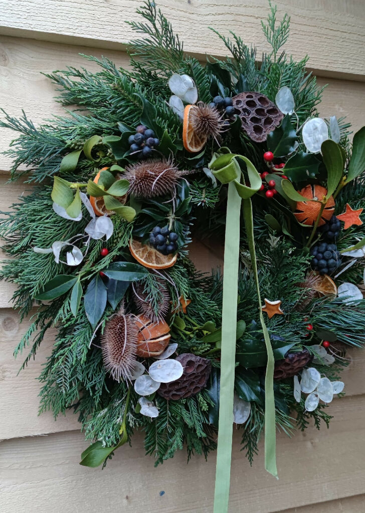 Christmas Wreath made from Fresh Evergreen Branches and Natural Decorations