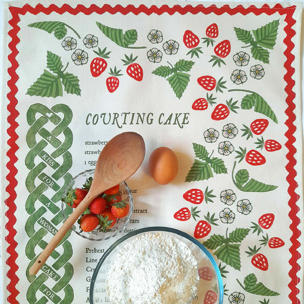 Courting Cake heritage recipe organic cotton tea towel by Miller Honeyman with strawberry and knotwork design.