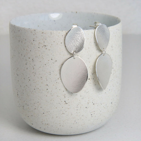 Silver double curled petal stud earrings