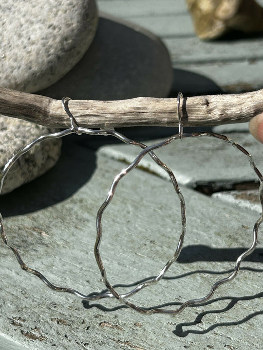 Wavy silver hoops