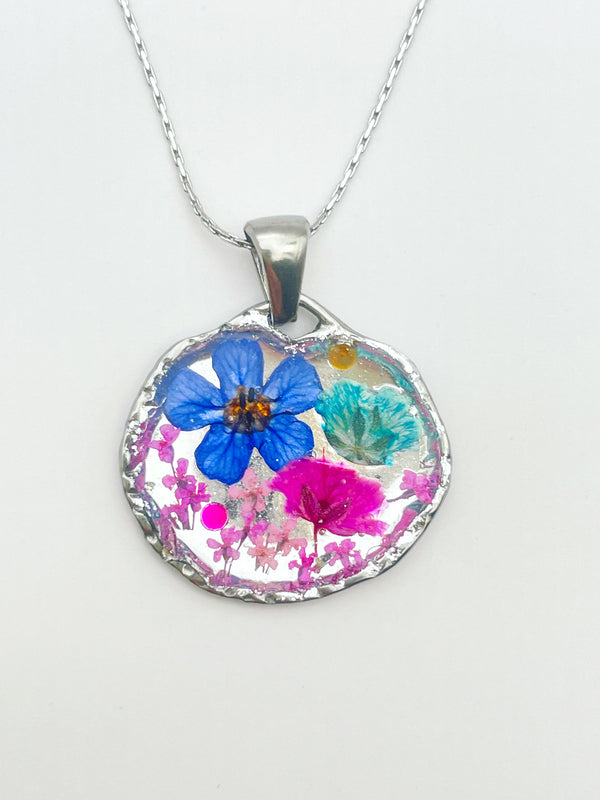 Silver pendant necklace with pink and blue flowers