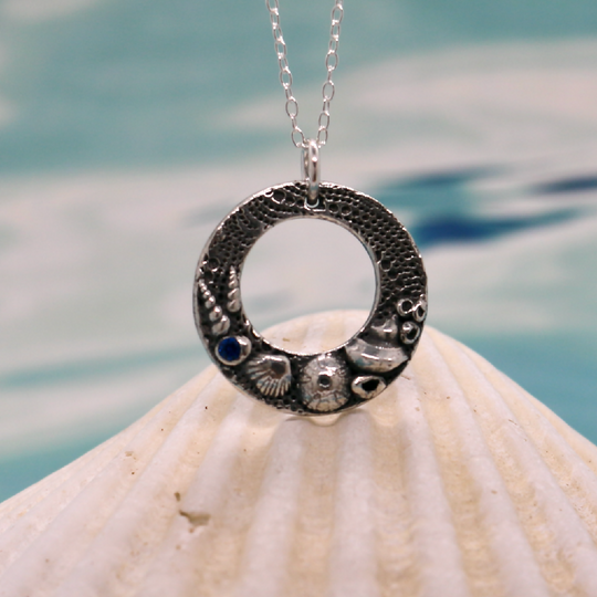 Silver sea shells circular necklace