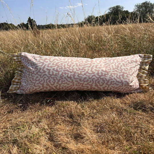 Pink and yellow long cushion
