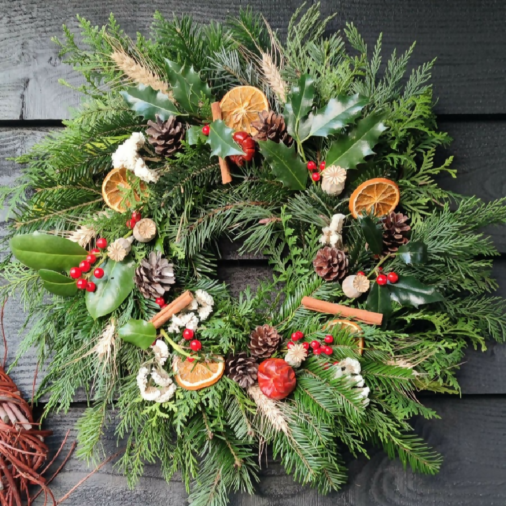 Christmas Wreath made from Fresh Evergreen Branches and Natural Decorations