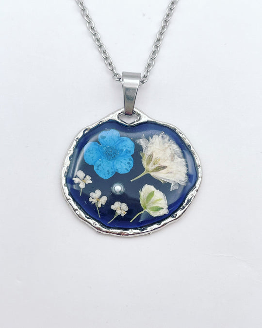 Black necklace with blue and white flowers