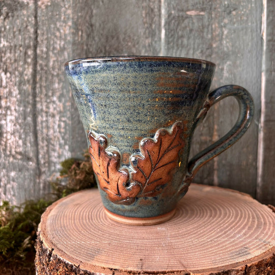 Mug with applied oak leaf decoration ceramic pottery rustic Blue