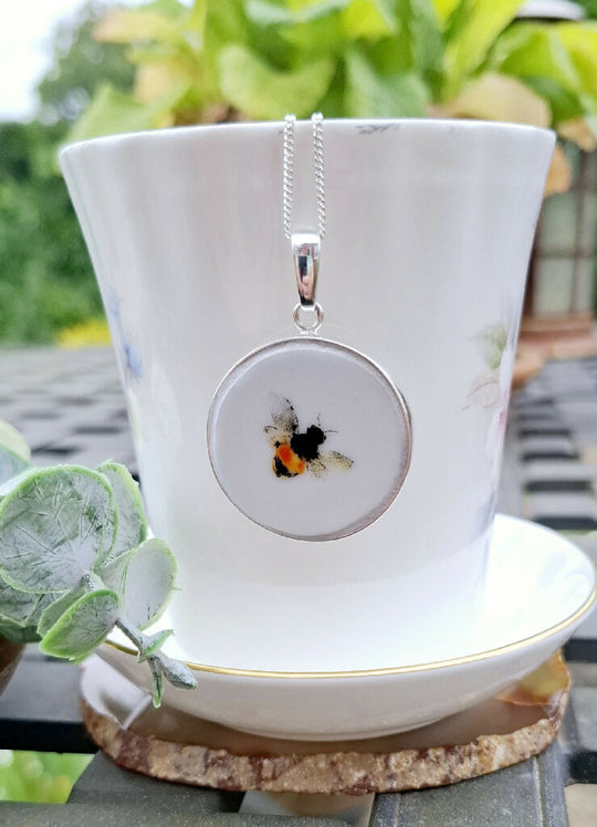 Large broken china bee pendant