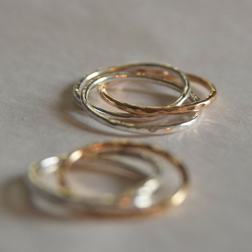 Linked knot triple ring