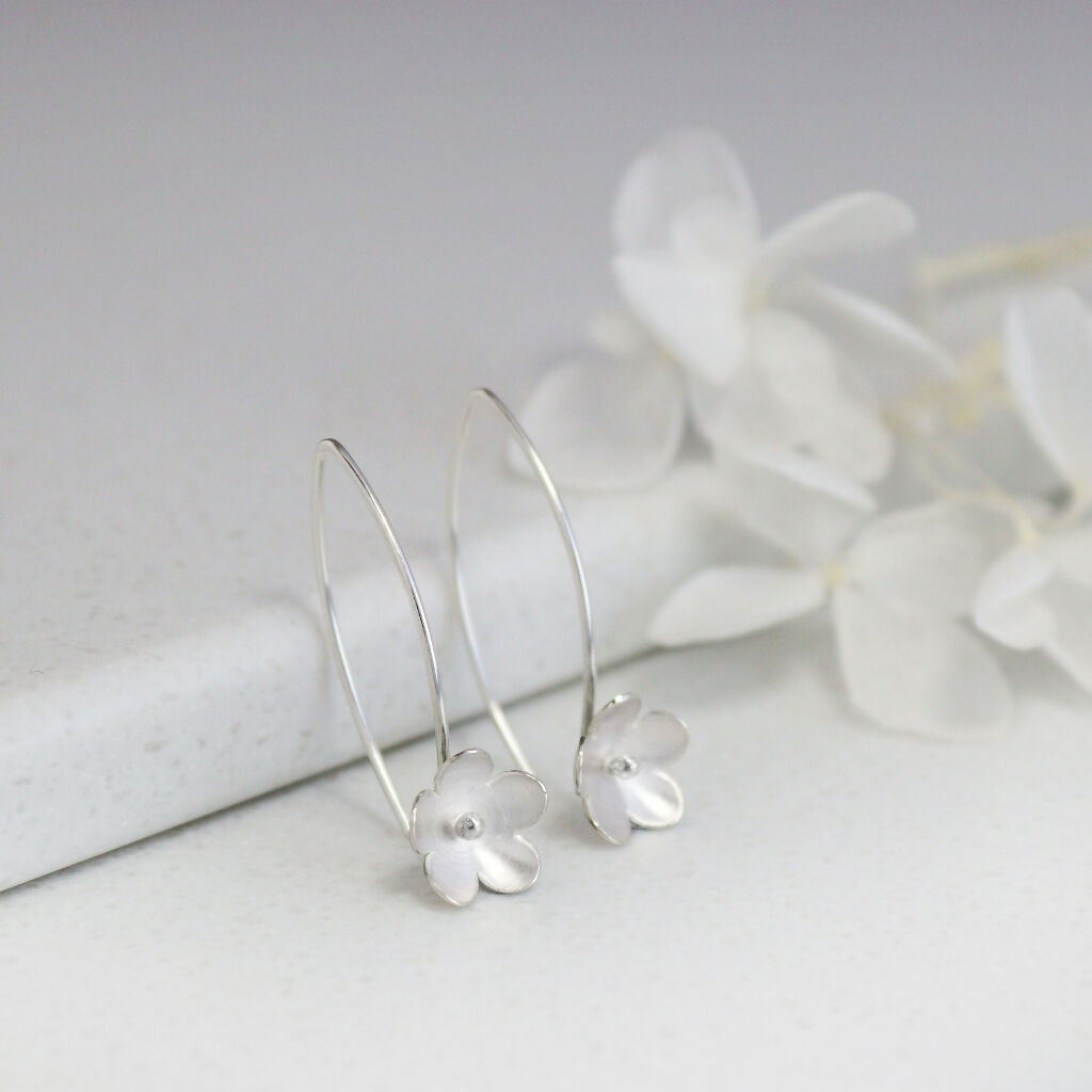 Small silver blossom long earrings