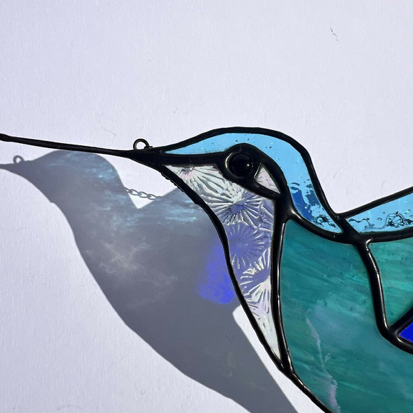 Sparkling sea blue stained glass hummingbird