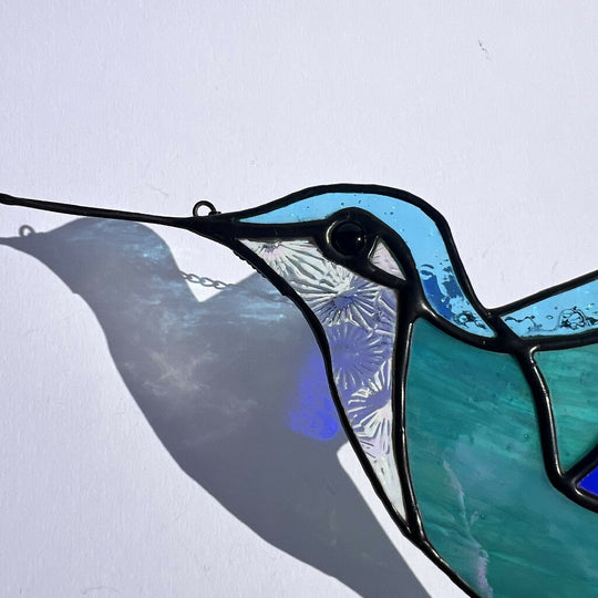 Sparkling sea blue stained glass hummingbird
