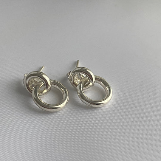Two Small Interlinked Hoop Sterling Silver Stud Earrings