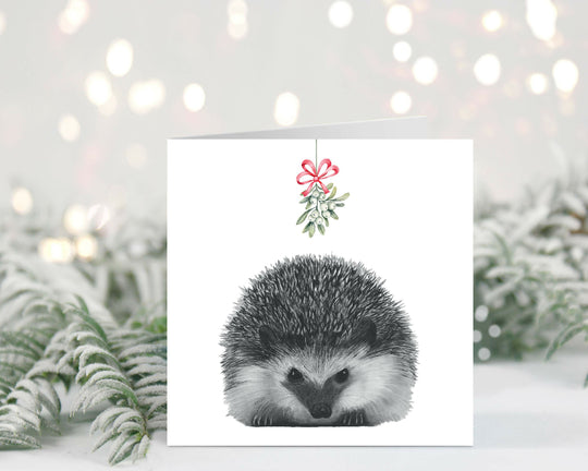 Cute Hedgehog Mistletoe Christmas card illustration, perfect for animal lovers