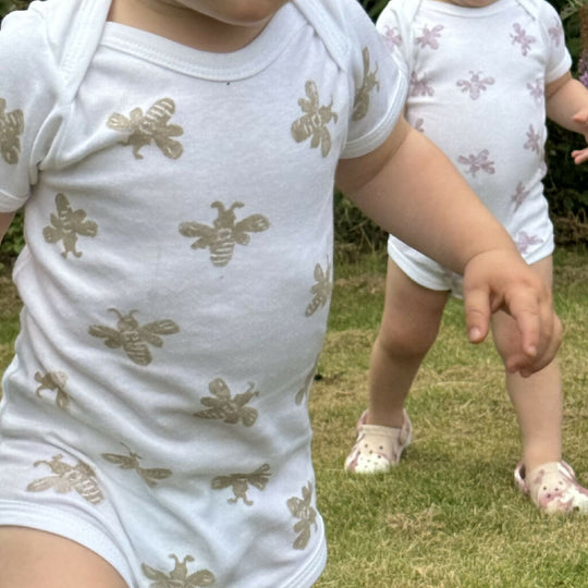 Block printed bee baby grow