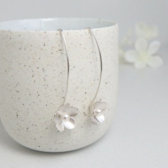 Large silver and pearl blossom long earrings