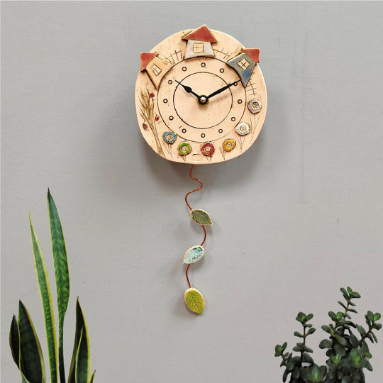 Round Ceramic Pendulum Wall Clock with Houses, Trees, and Meadows