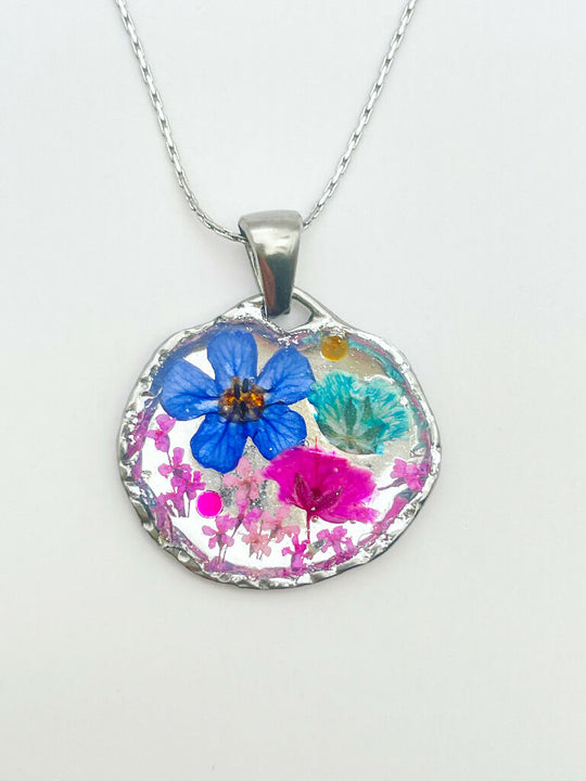 Silver pendant necklace with pink and blue flowers