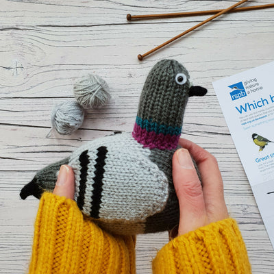 knitted pigeon being held