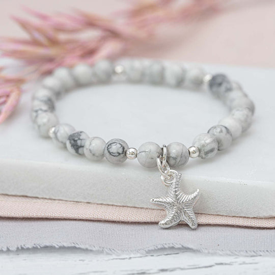 Howlite beaded bracelet with fine silver charm