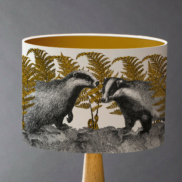 Handmade badger lampshade featuring vintage animal etchings of two badgers in autumn bracken, with monochrome detailing and colourful accents, perfect for a country cottage interior.