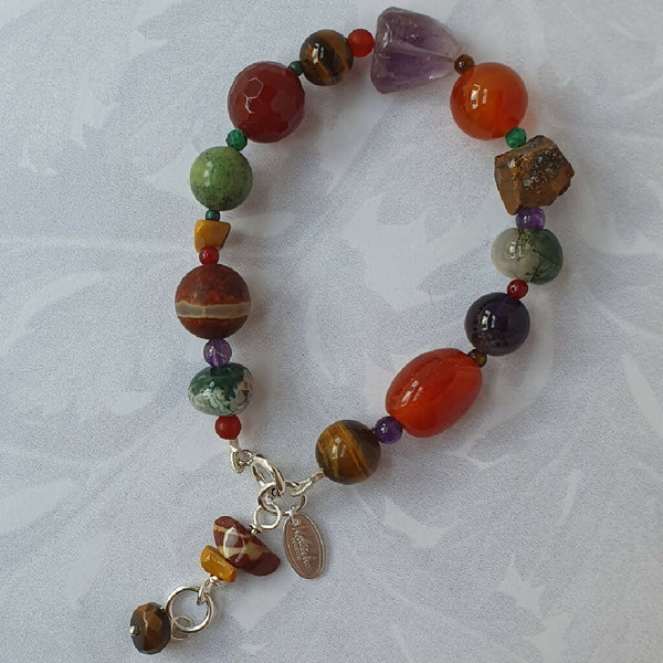 Russet Pebble gemstone bracelet, with brown tiger's eye, orange carnelian, green serpentine and purple amethyst.