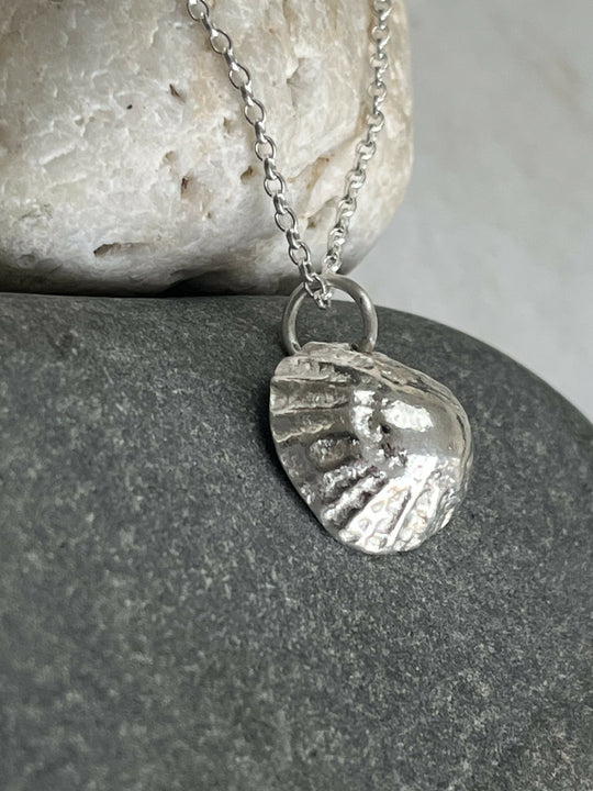 A Fine silver limpet shell pendant
