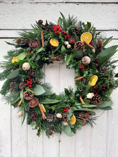 Christmas Wreath made from Fresh Evergreen Branches and Natural Decorations