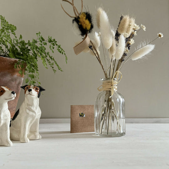 Small Gift Wrapped Bunch of a few Dried Flowers and a Rustic Fluffy Bumblebee in a Bud Vase.