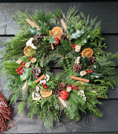 Christmas Wreath made from Fresh Evergreen Branches and Natural Decorations