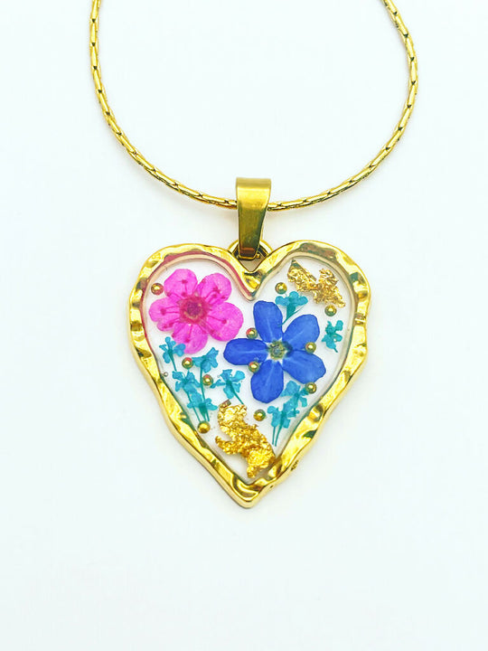Heart necklace with forget-me-not and pink flowers