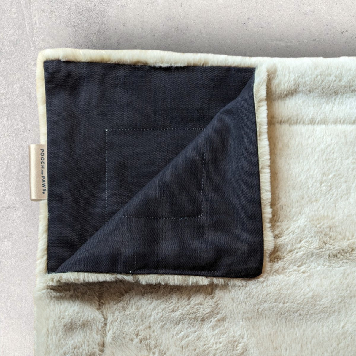 Dog Blanket  in faux fur with navy backing 