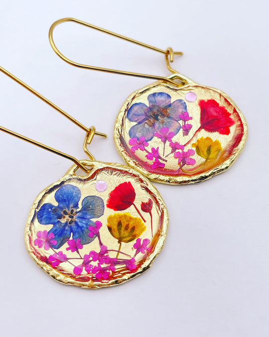 Gold dangle earrings with poppy and blue flowers