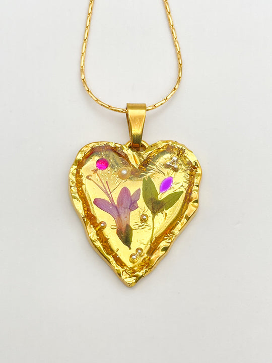 Gold heart necklace with lily flowers