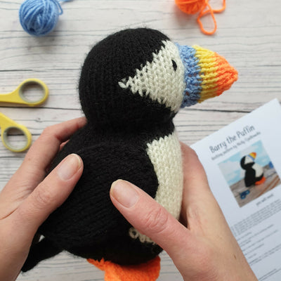 knitted puffin being held