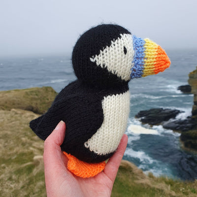 knitted puffin from a knit kit on cliffs