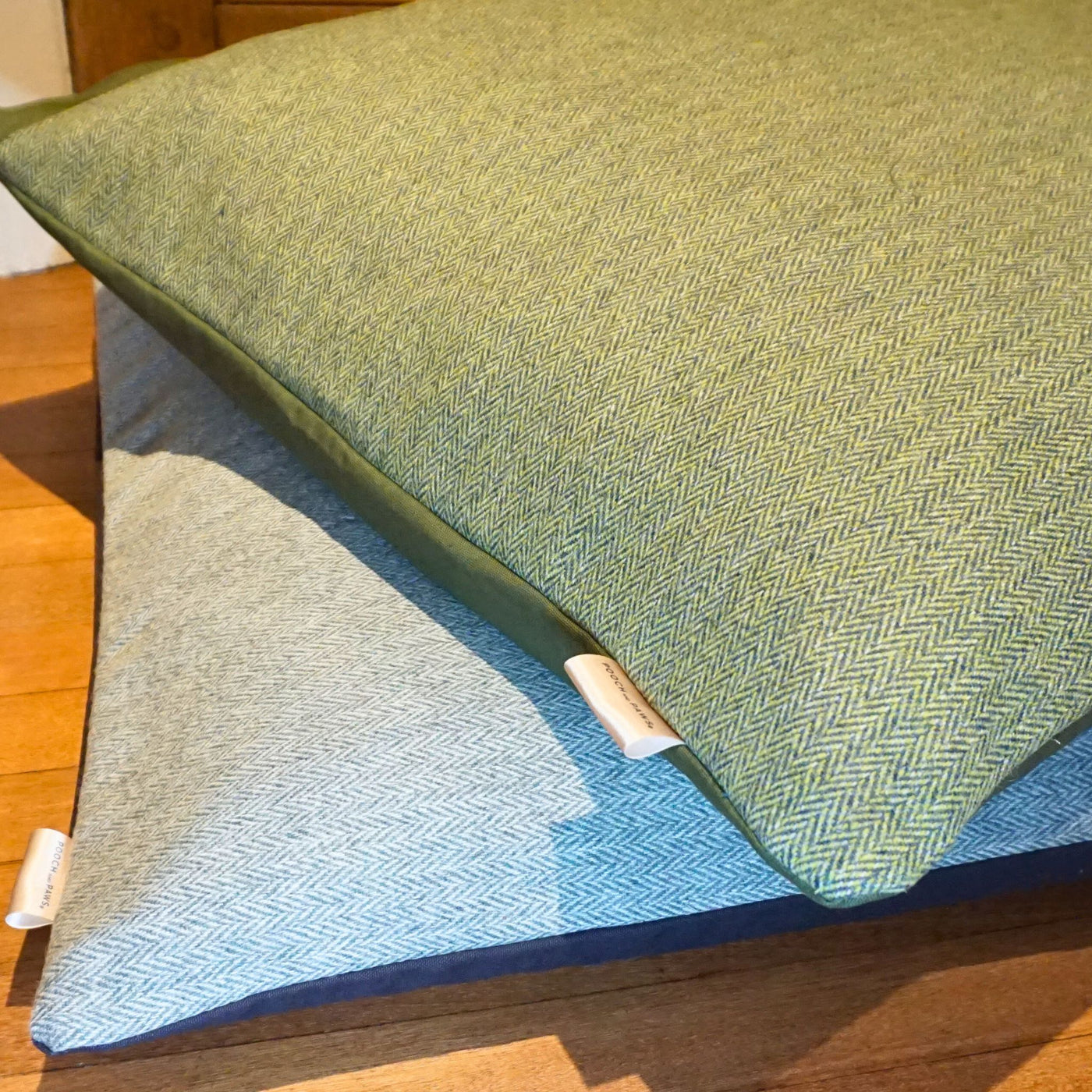 Herringbone tweed dog cushions in green and blue tweed designs