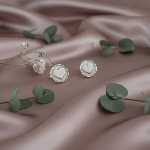 Silver round studs with 3d hearts