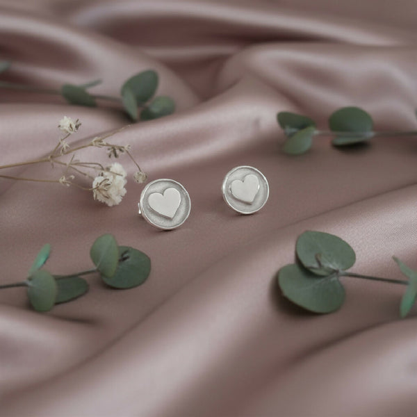 Silver round studs with 3d hearts