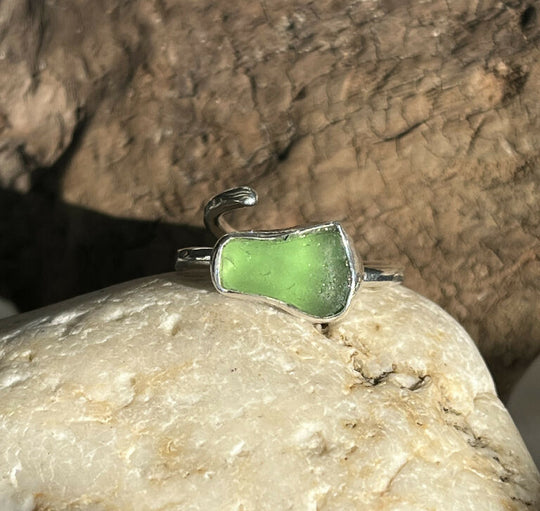 A handmade adjustable recycled sterling silver lime green sea glass ring
