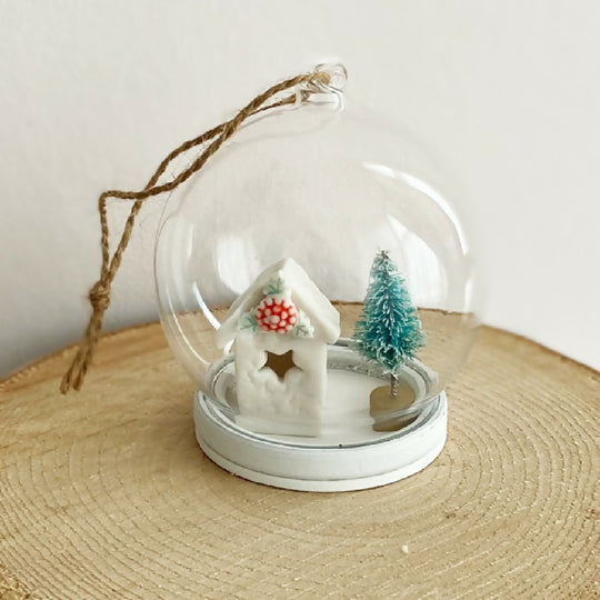 A Glass Bauble With Holly House Decoration