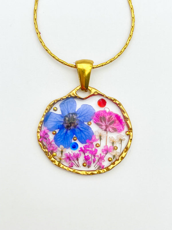 Pendant necklace with blue and pink flowers