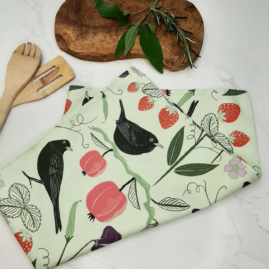 Fruit & Birds pattern tea towel in pink or green