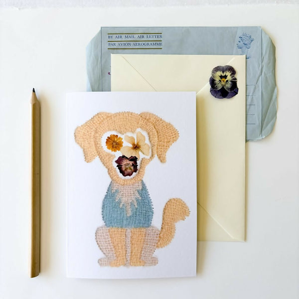 Botanical Golden Retriever greetings card featuring artwork originally hand embroidered with silk and alpaca yarn and inspired by traditionally pressed flowers. Blank inside with an envelope.