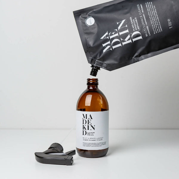 1 litre multi surface cleaner refill pouch being poured into an empty bottle