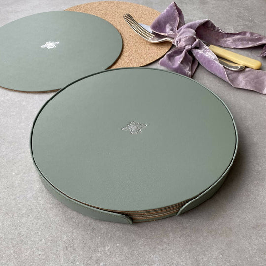 A Set of Six Recycled Leather Placemats with Bee Motif