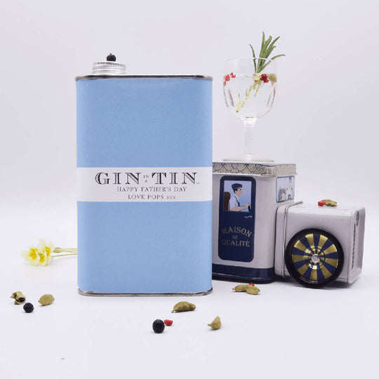 A PERSONALISED BLUE TIN OF GIN