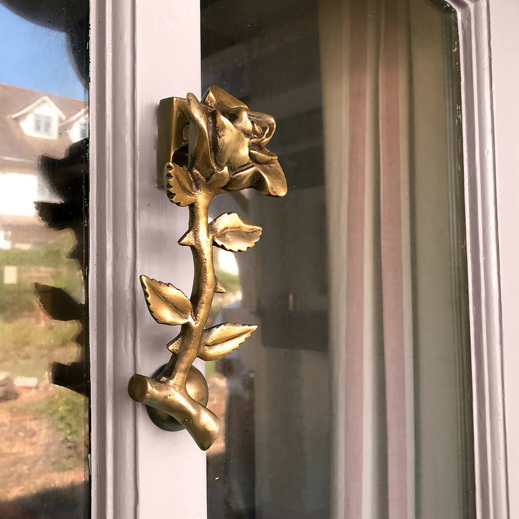 Nola Flower Door Knocker in Aged Brass