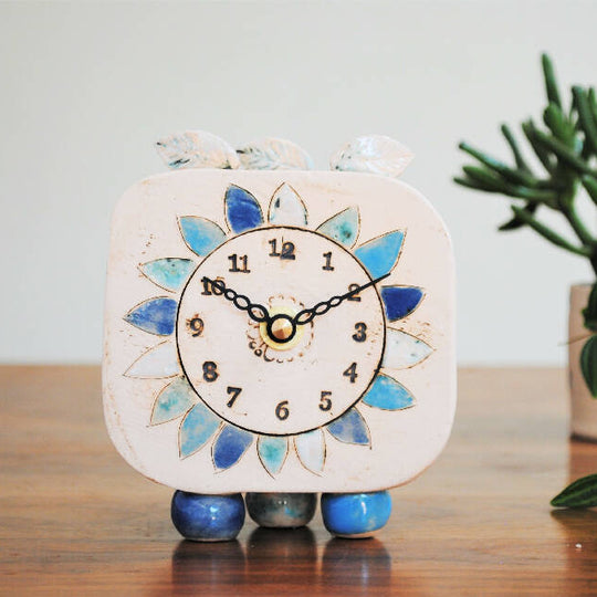 Small Handmade Clock With Pebble Feet and Blue Petals